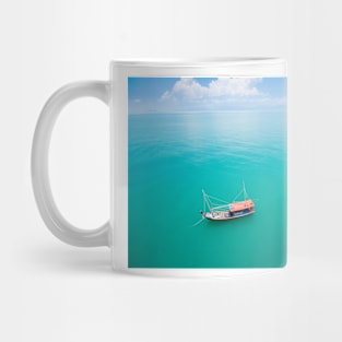 Aerial view of fishing boat on emerald sea Mug